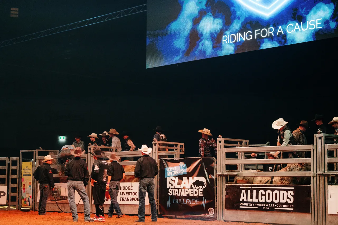 Bull Riders at the Island Stampede Rodeo
