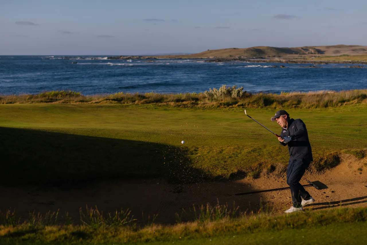 Golfer Chipping from Bunker