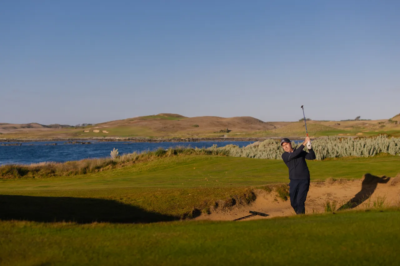 Golfer Chipping from Bunker