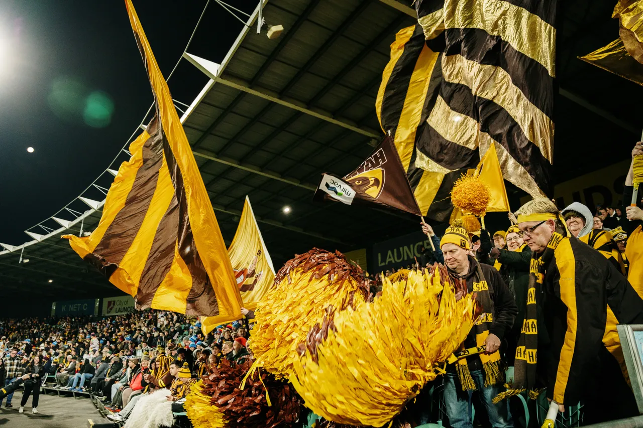 Waving Hawks Flags at UTAS Stadium