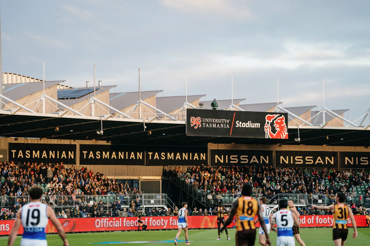 Spectators Watching Football at UTAS Stadium