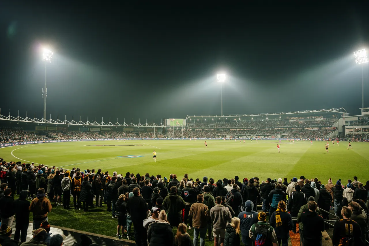 Spectators Watching Football at UTAS Stadium