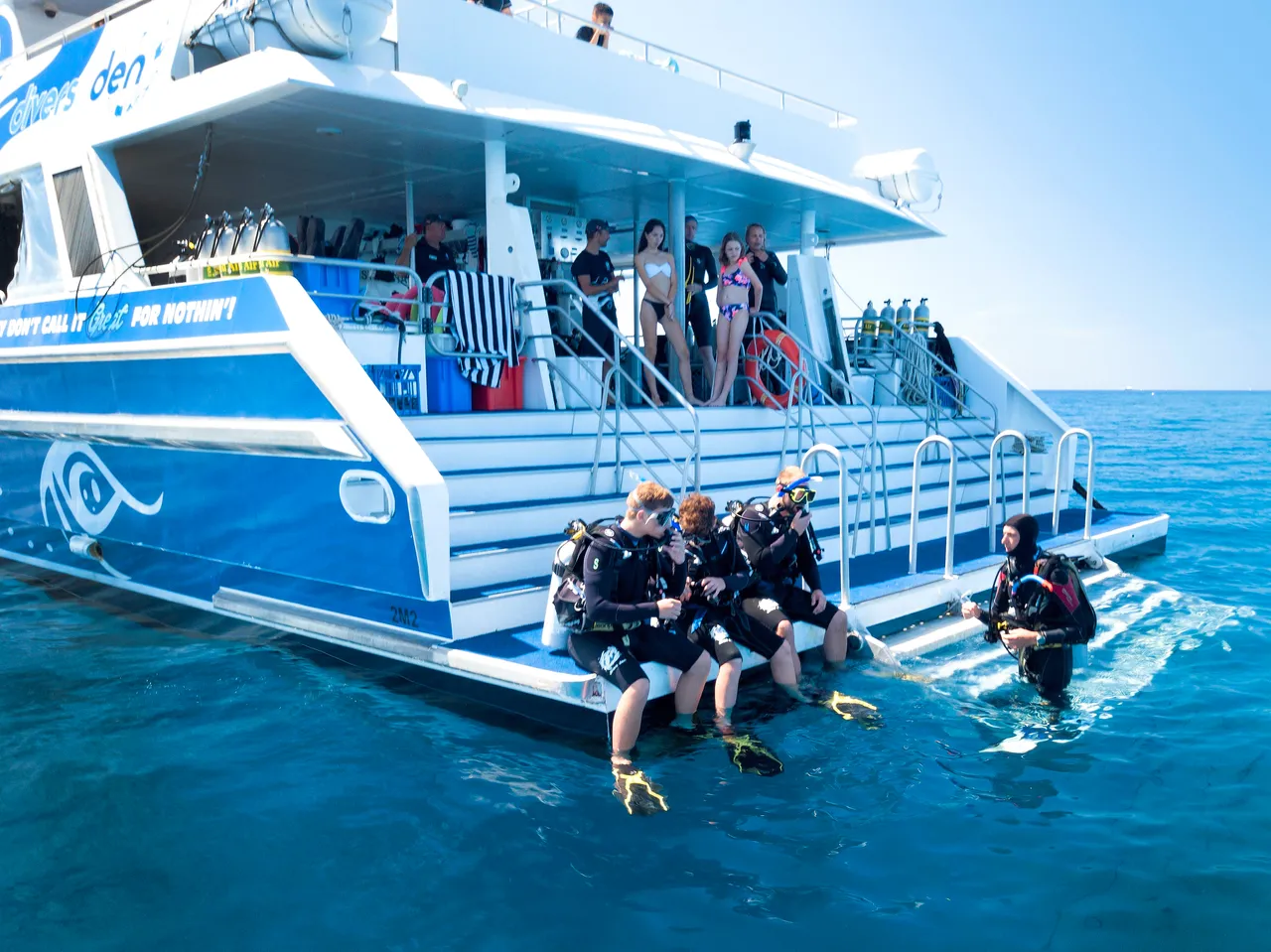 Group & staff by the rear of the vessel