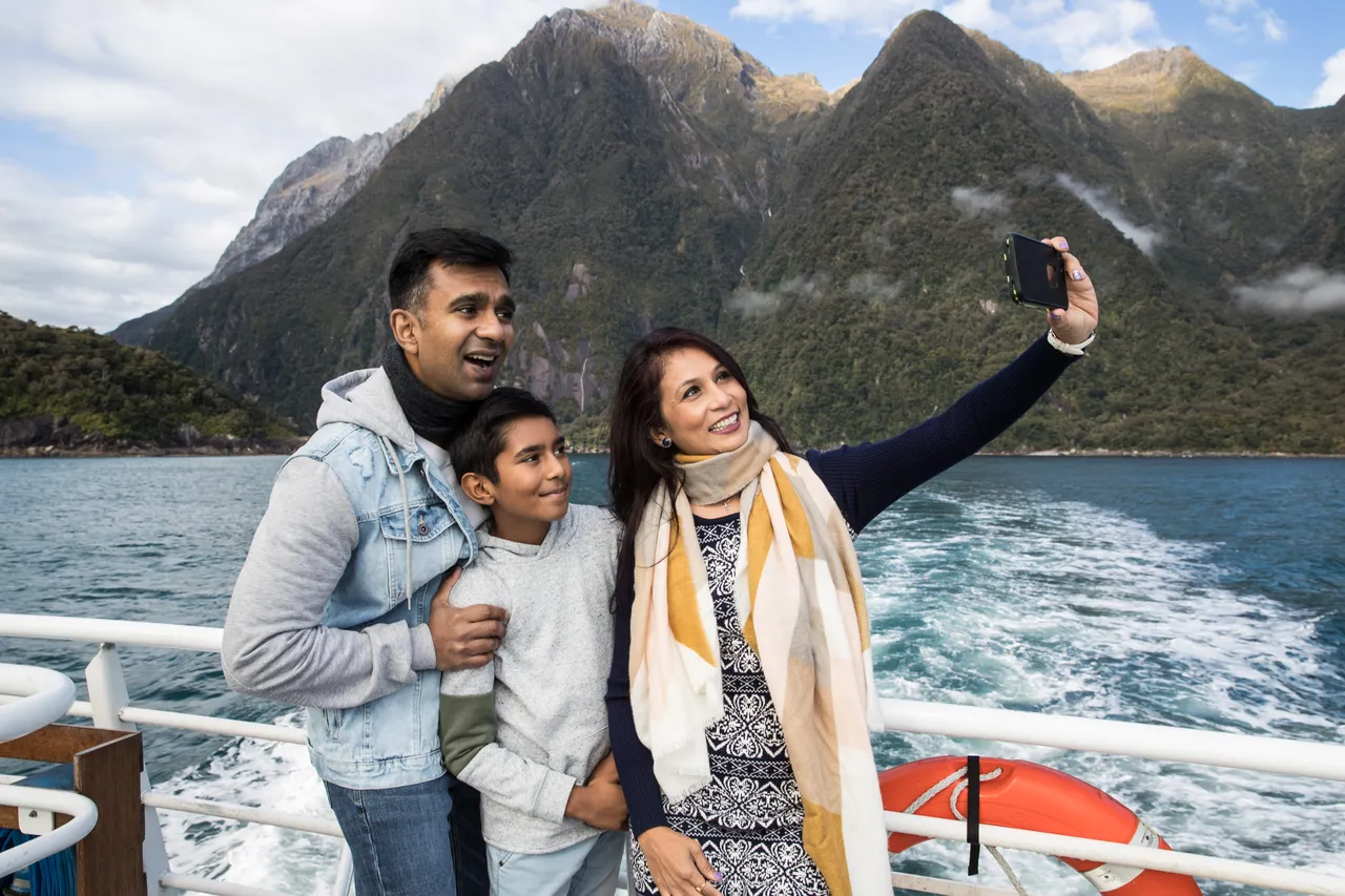 Indian family getting selfies on Milford Sound cruise