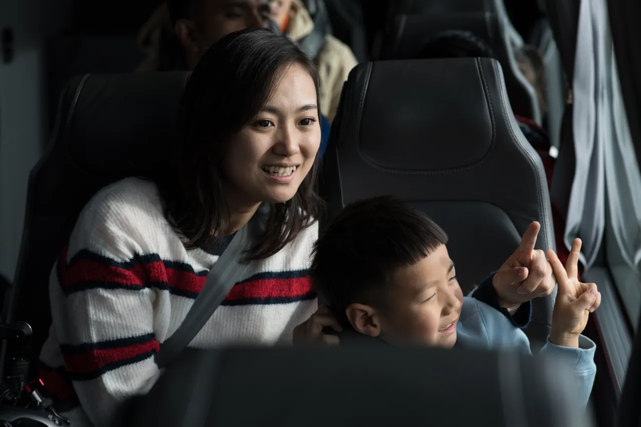 Chinese mother and child inside the GreatSights coach