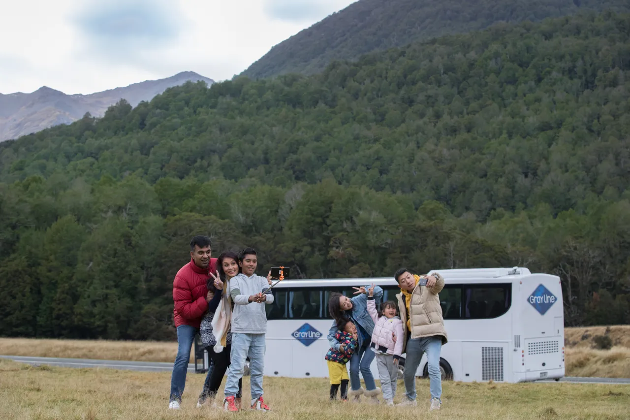 Tour group taking photos at Eglinton Valley