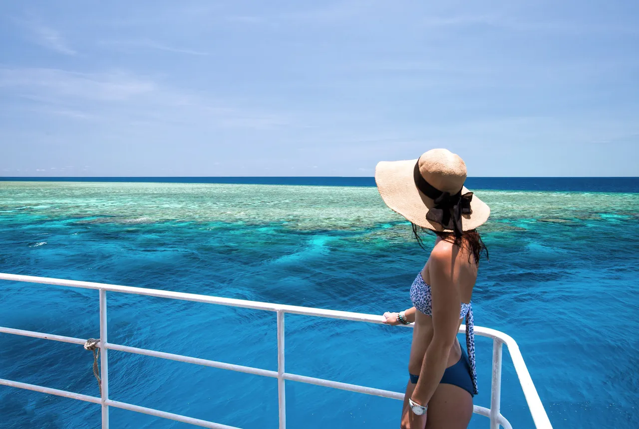 European lady standing on the rail of SeaQuest vessel
