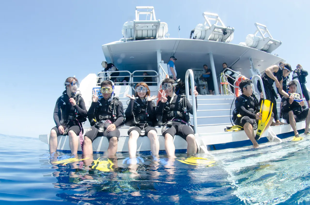 Group sitting on the rear of SeaQuest Vessel
