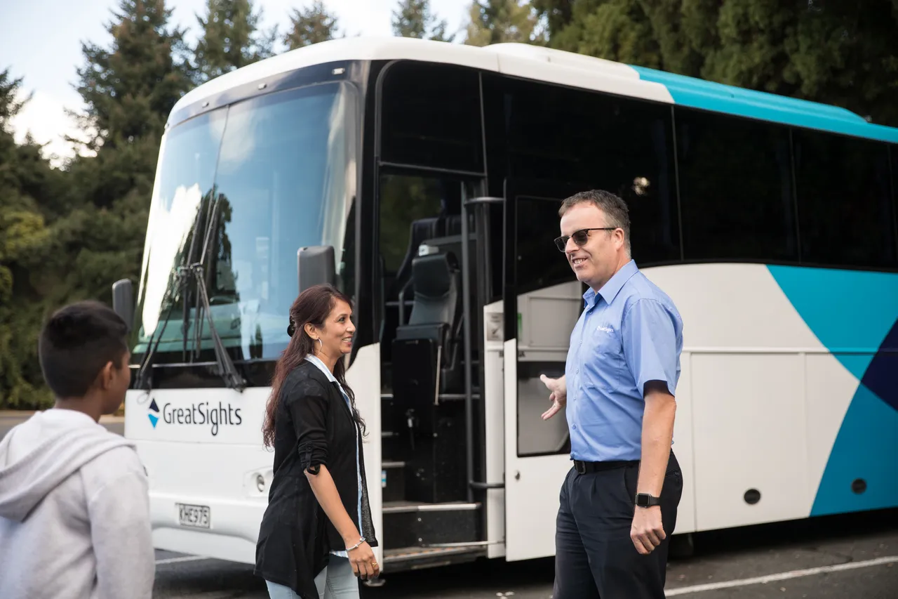 GreatSights driver welcomes Indian guests boarding coach