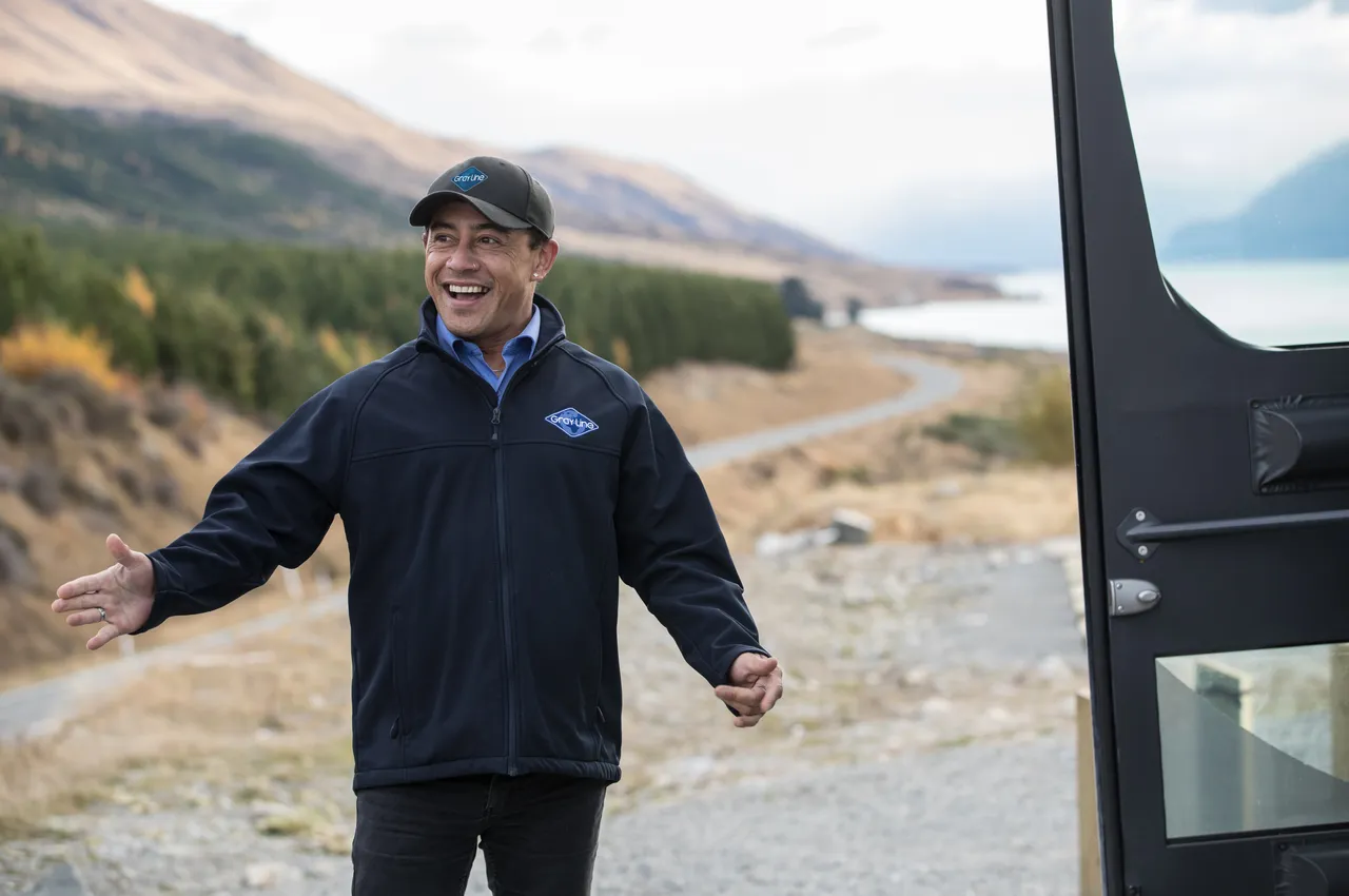 GrayLine driver welcomes guests on board