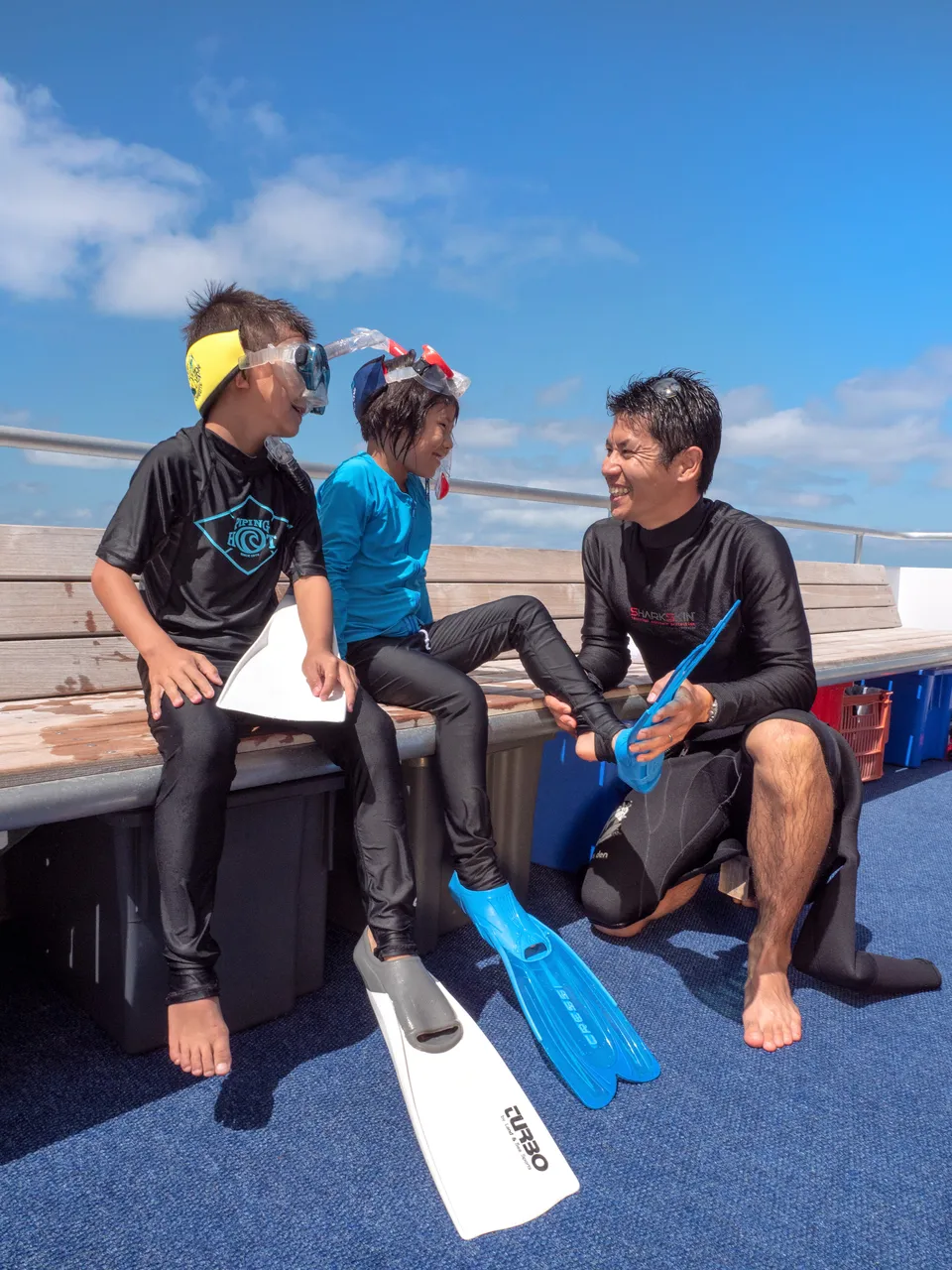 Asian children being prepped by a male staff
