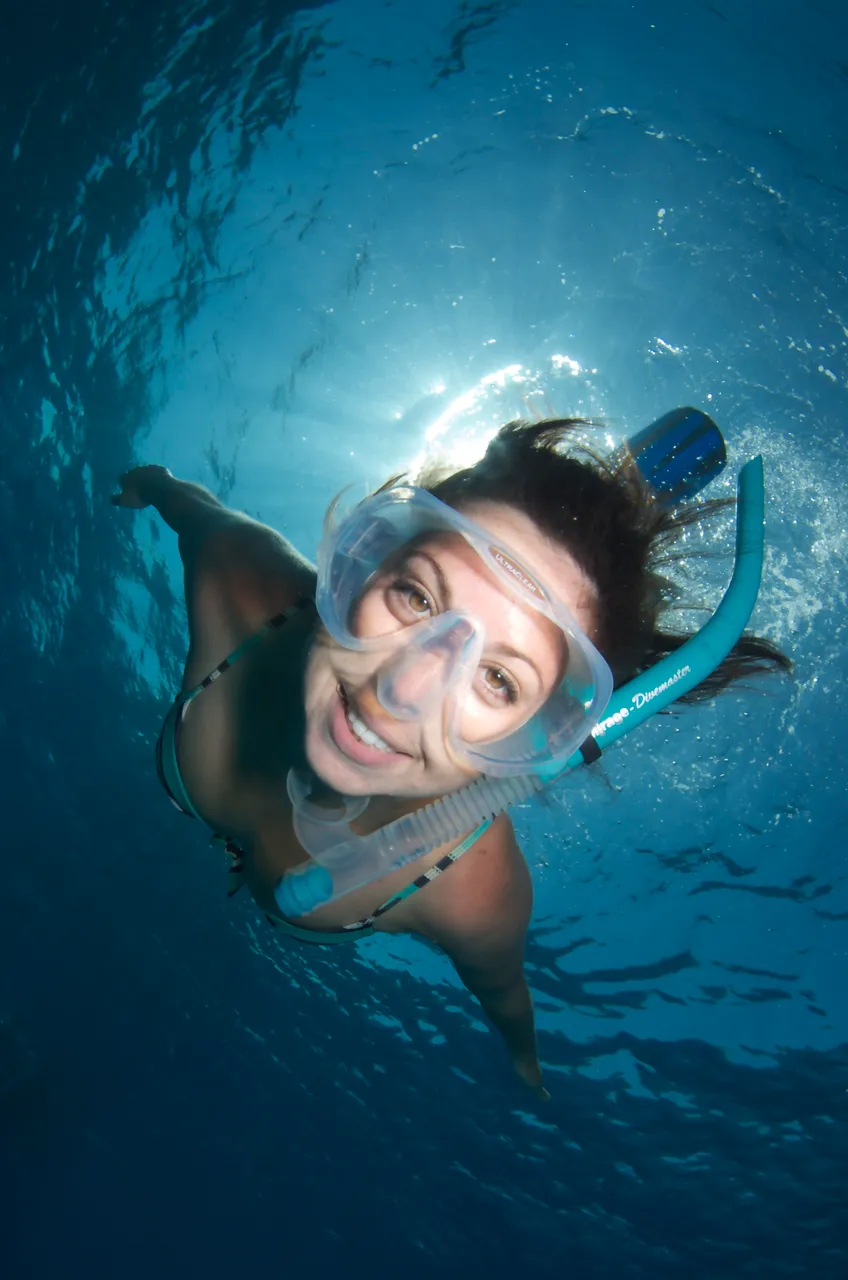 European female swimming directly to the camera