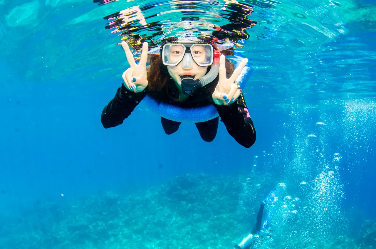 Asian lady solo shot on the Great Barrier Reef