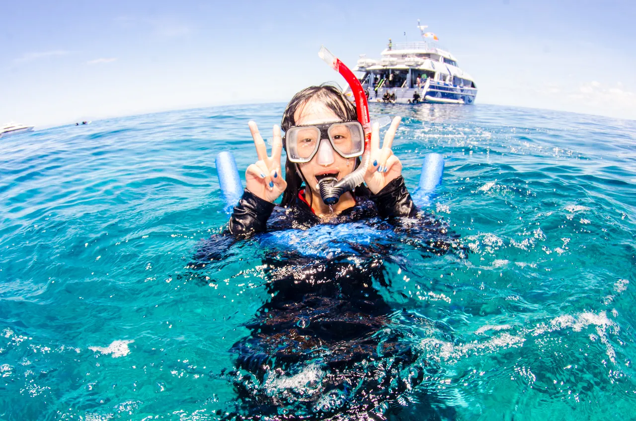 Asian lady solo shot on the Great Barrier Reef