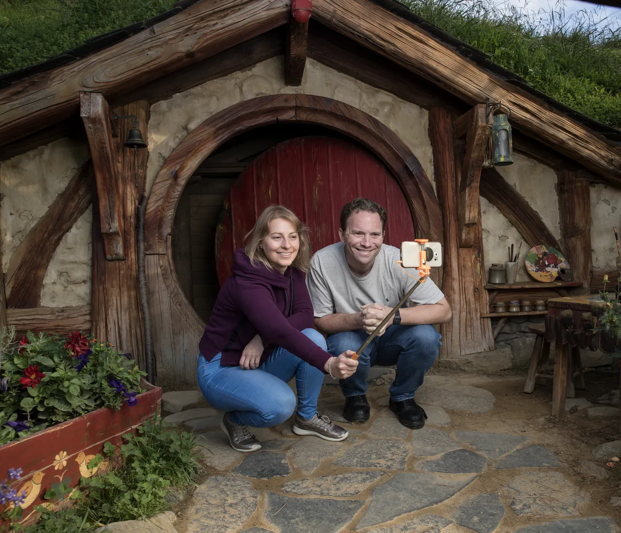 European couple taking selfie at Hobbiton