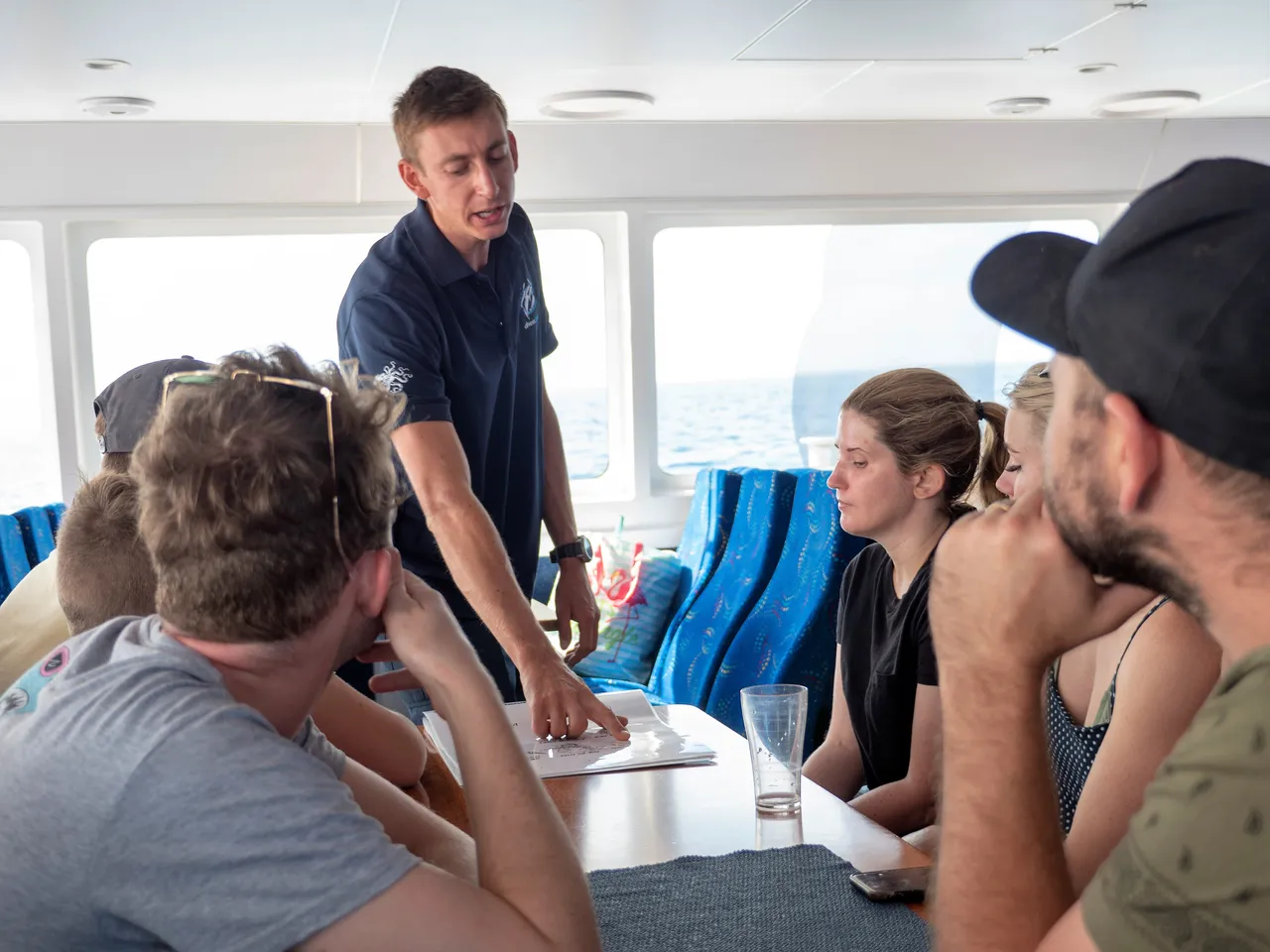 Staff instructing group indoors