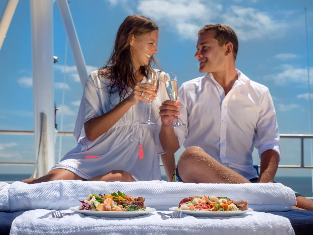 European couple having a meal on the sun deck