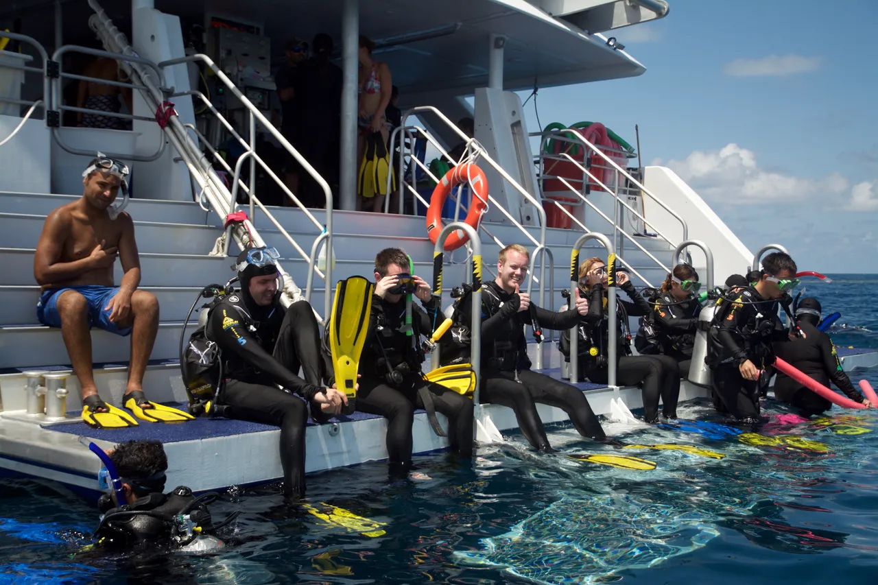 Group sitting on the rear of ReefQuest Vessel