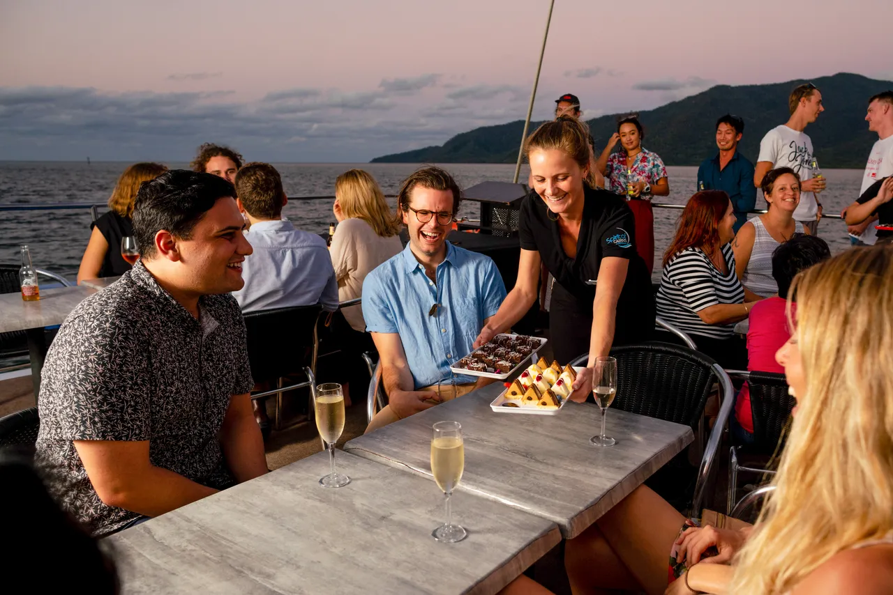 Group eating on the sun deck of Spirit of Cairns