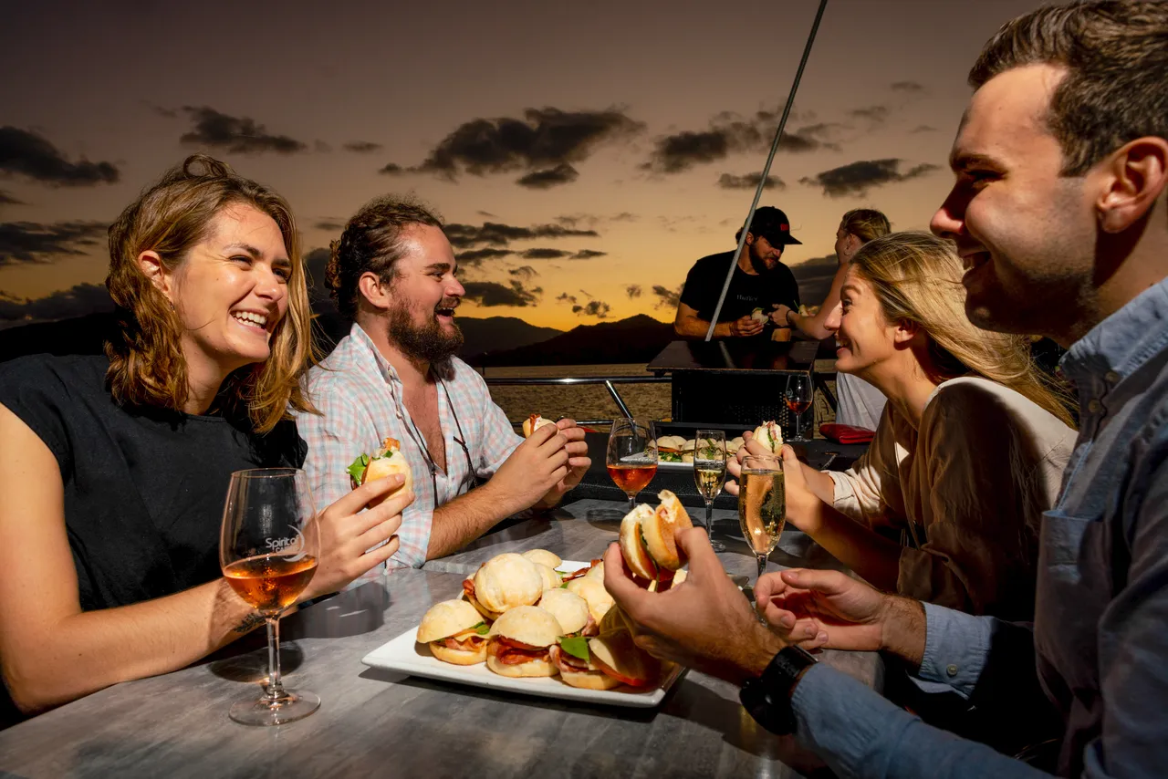 Group eating on the sun deck of Spirit of Cairns