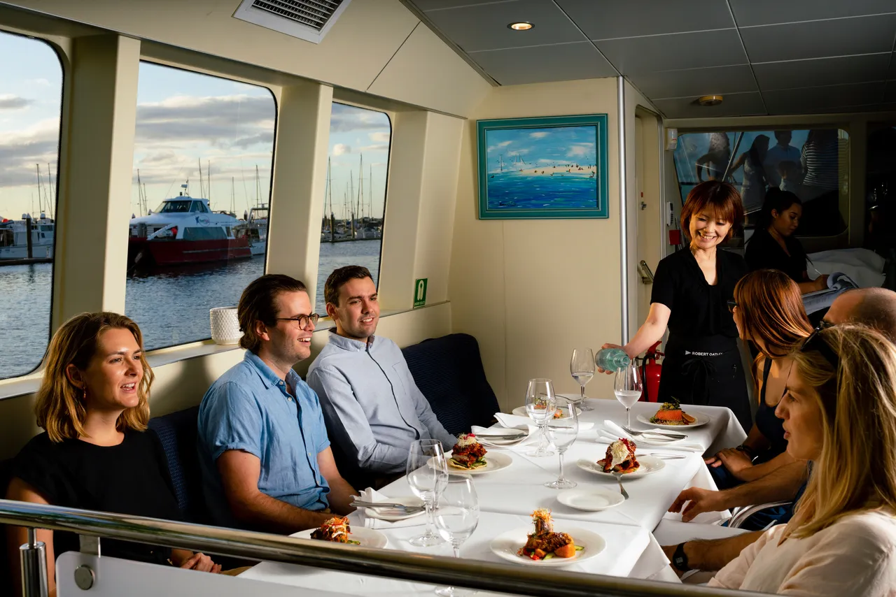 Group eating dinner cruise on the Spirit of Cairns
