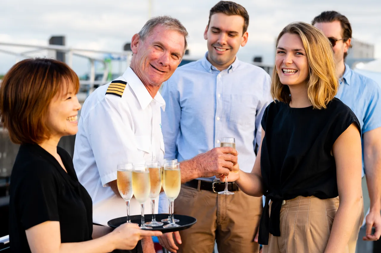Spirit of Cairns staff welcoming passengers aboard