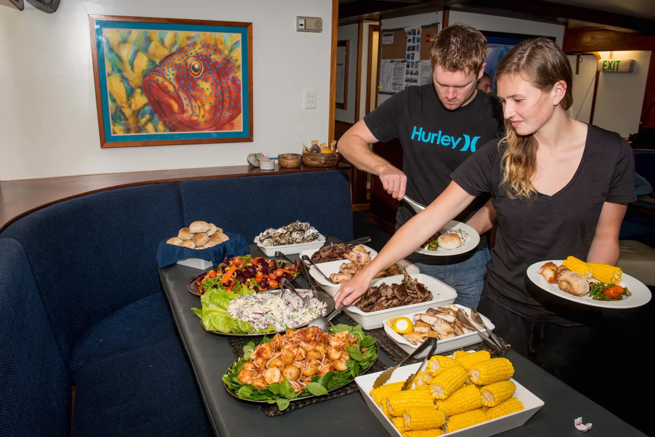 European couple at buffet on Spirit of Freedom
