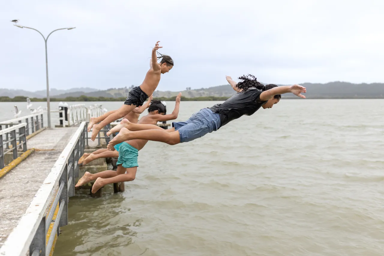 Jumping off Rawene Wharf