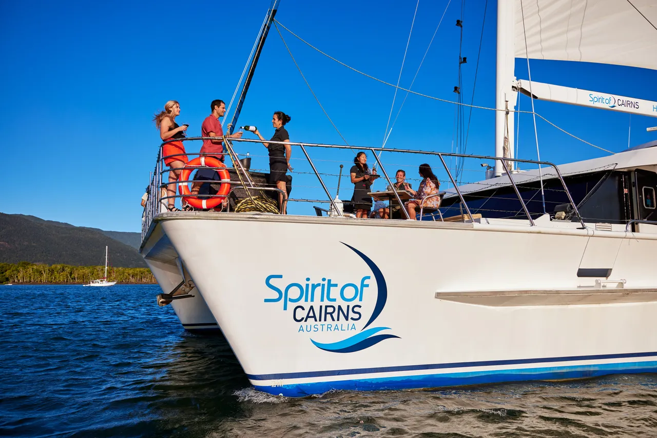 Passengers having a drink on the deck of Spirit of Cairns (1)