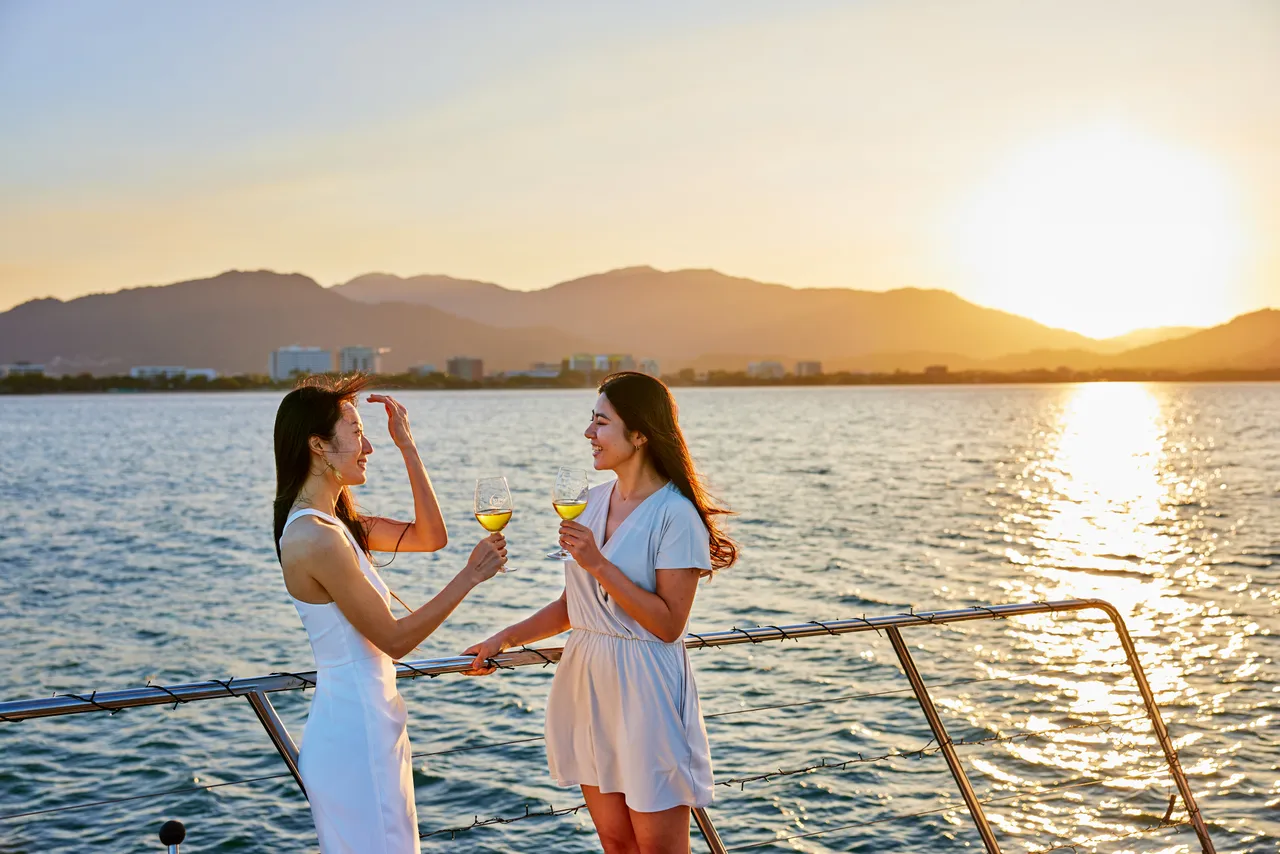 Ladies having a drink on the deck of Spirit of Cairns