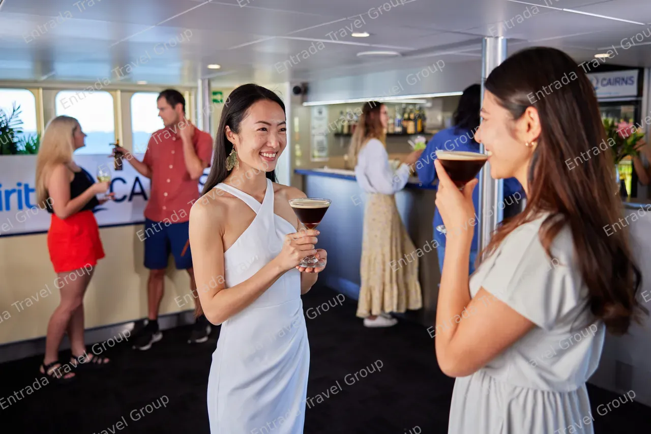 Passengers having a drink in the bar area on Spirit of Cairns