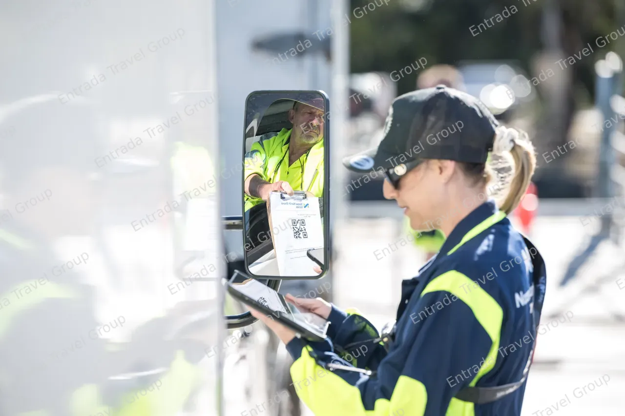 Noosa North Shore Ferries - Staff checking passenger tickets 5
