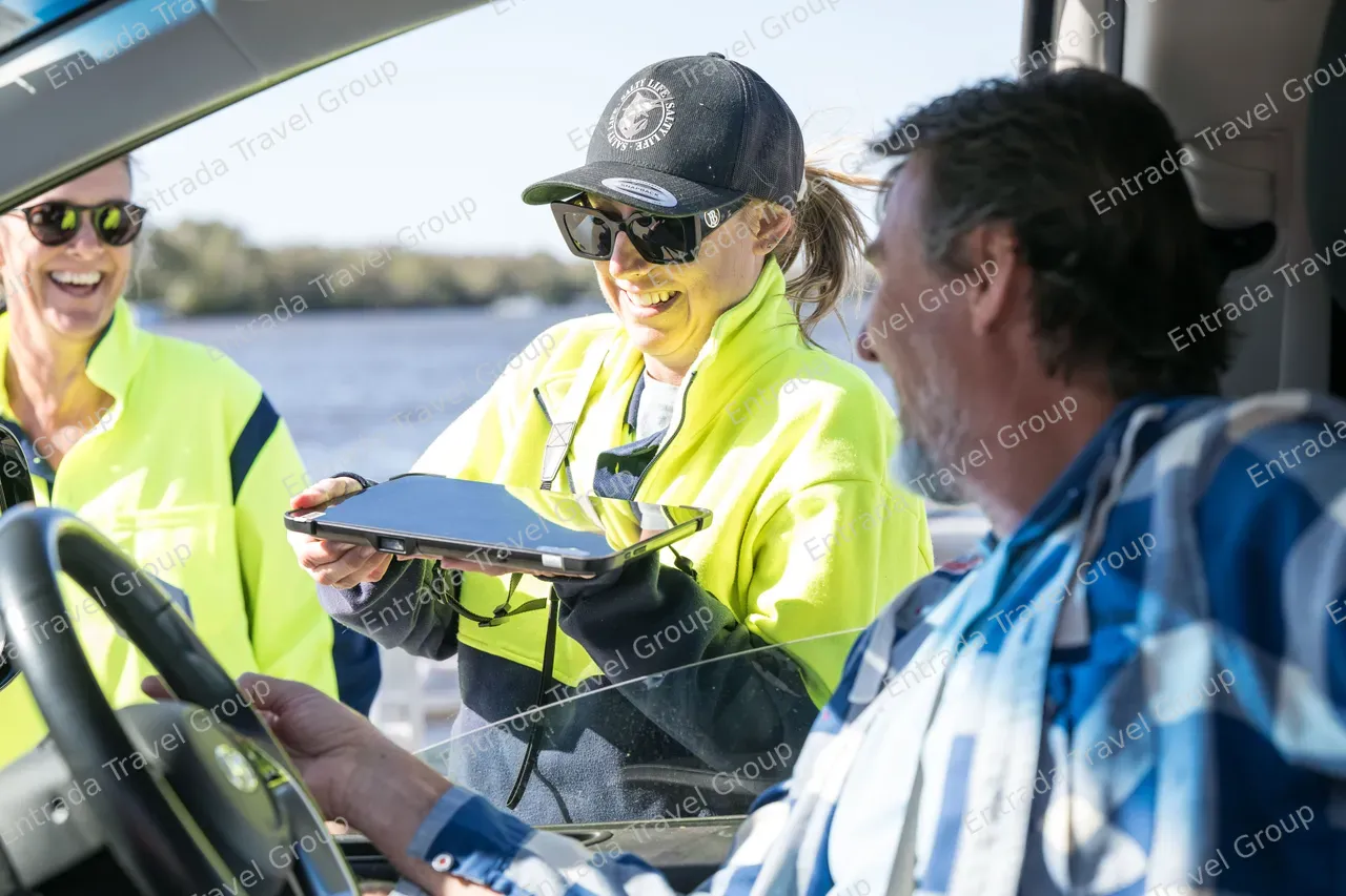 Noosa North Shore Ferries - Staff checking passenger tickets 3