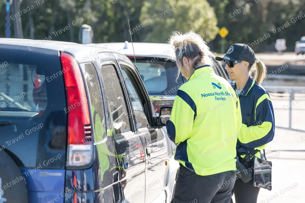 Noosa North Shore Ferries - Staff checking passenger tickets 1