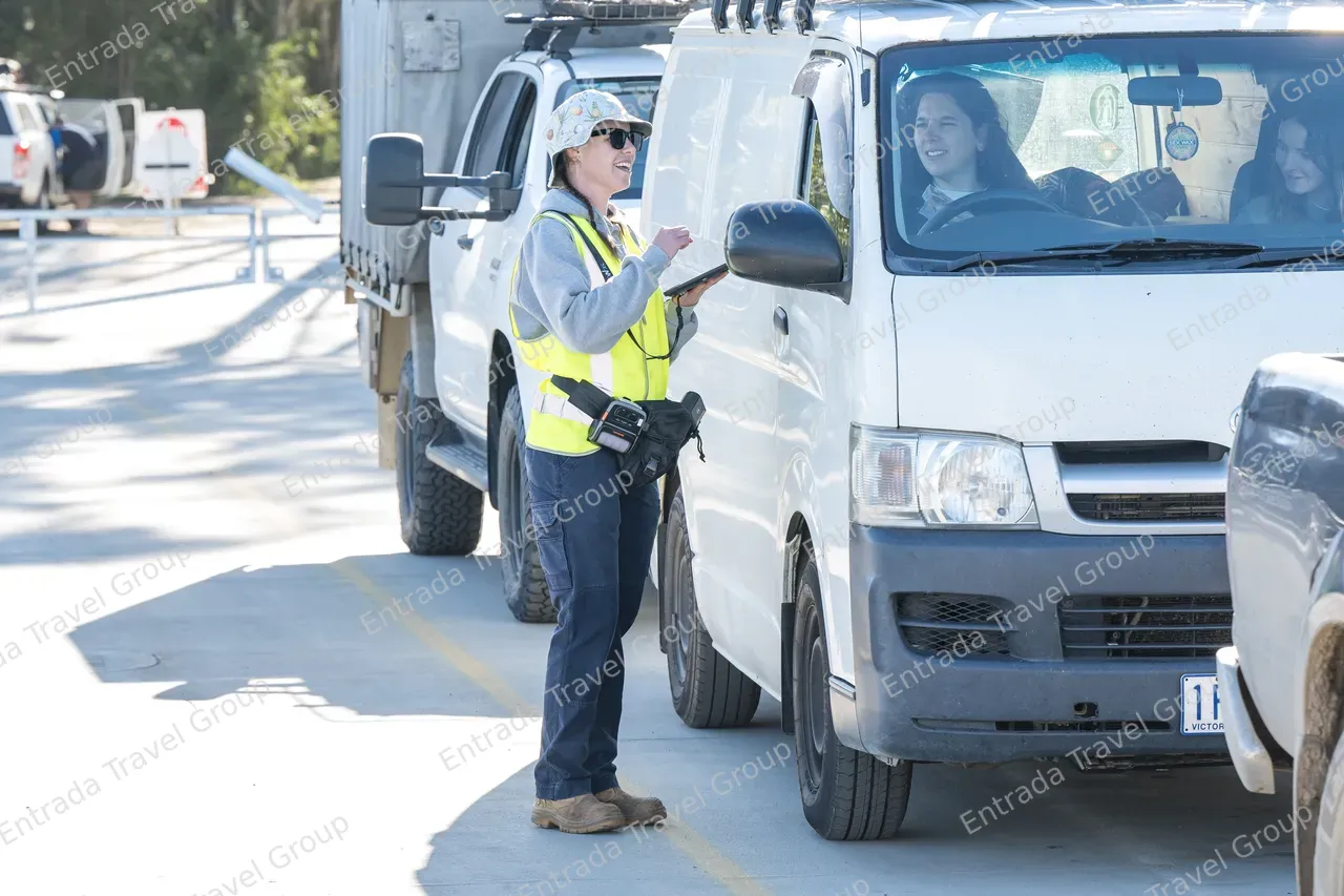 Noosa North Shore Ferries - Staff checking passenger tickets 2