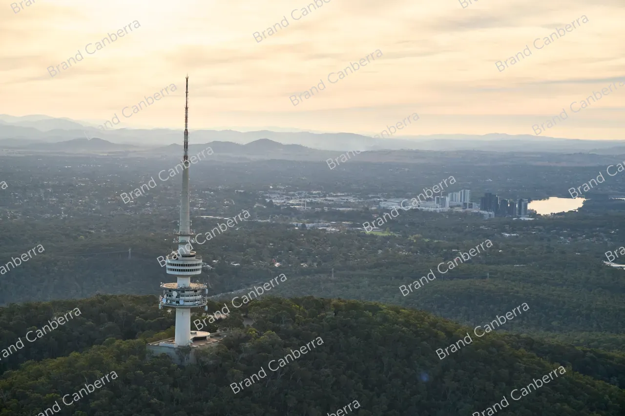 An aerial view over Canberra facing west with Telstra Tower in view and Belconnen town centre in the distance