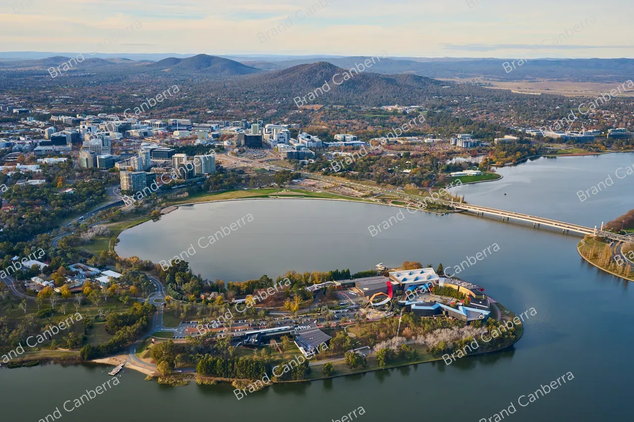 An aerial view over Canberra facing east with the National Museum of Australia in view and Canberra CBD in the distance (3)
