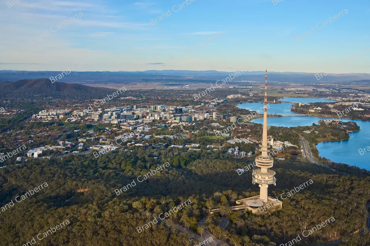 An aerial view over Canberra facing east with Telstra Tower, Canberra City and Lake Burley Griffin in view