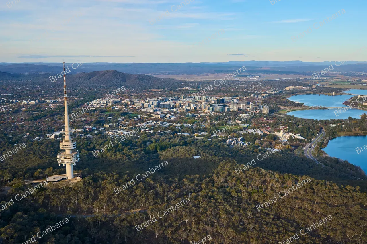 An aerial view over canberra facing east with Telstra Tower, Canberra City and Lake Burley Griffin in view
