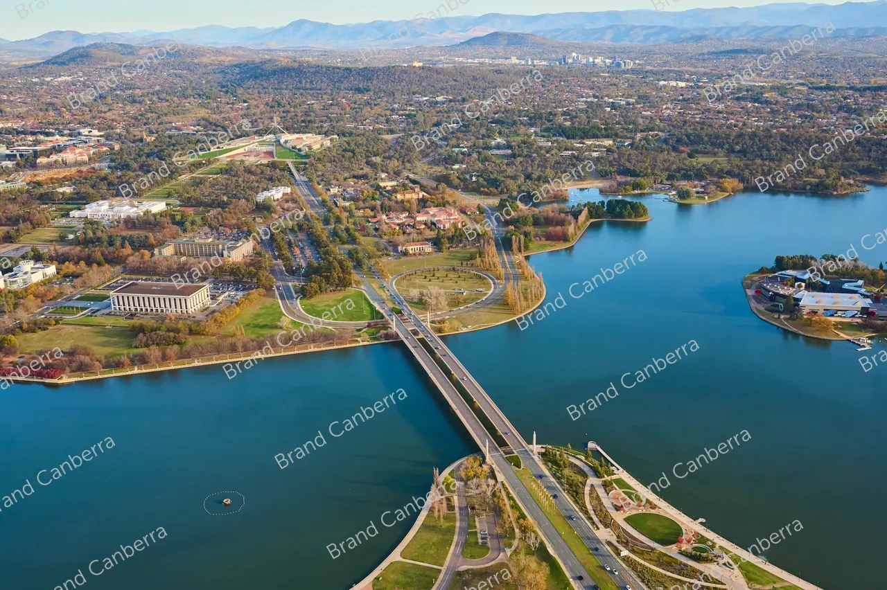 An aerial view over Canberra along Commonwealth Avenue bridge with Australia's Parliament House in view (3)