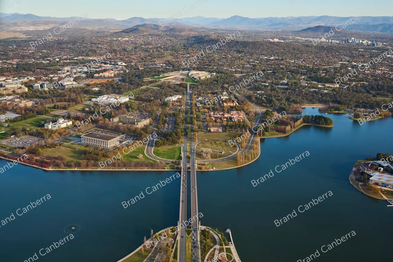 An aerial view over Canberra facing south along Commonwealth Avenue bridge with Australia's Parliament House in view