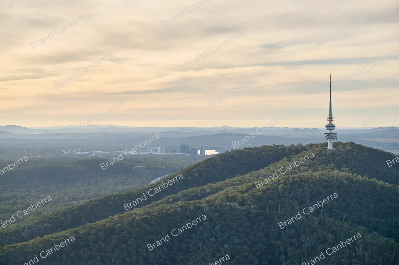 An aerial view over Canberra facing west with Telstra Towen in view and Belconnen town centre in the distance
