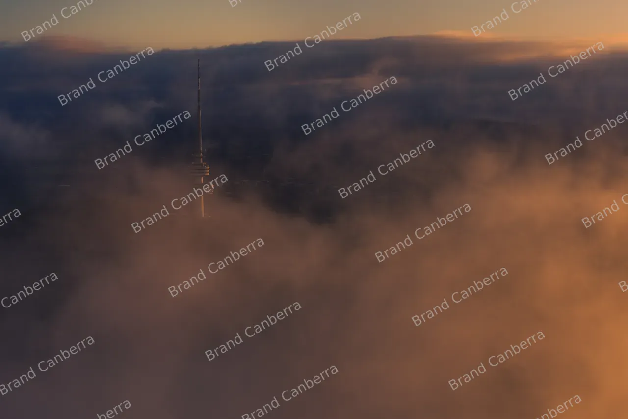 Aerial view of Telstra Tower through cloud cover