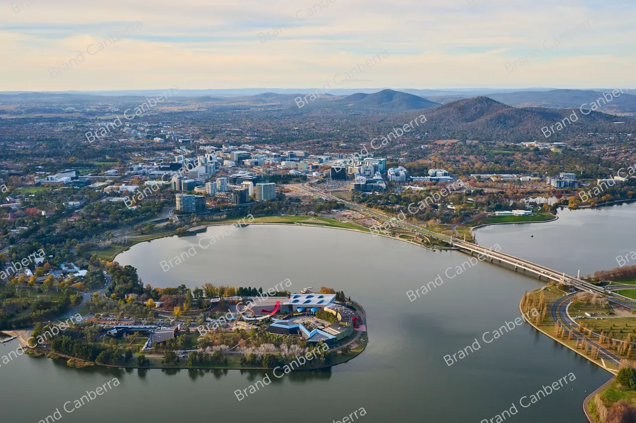 An aerial view over Canberra facing east with the National Museum of Australia in view and Canberra CBD in the distance (2)