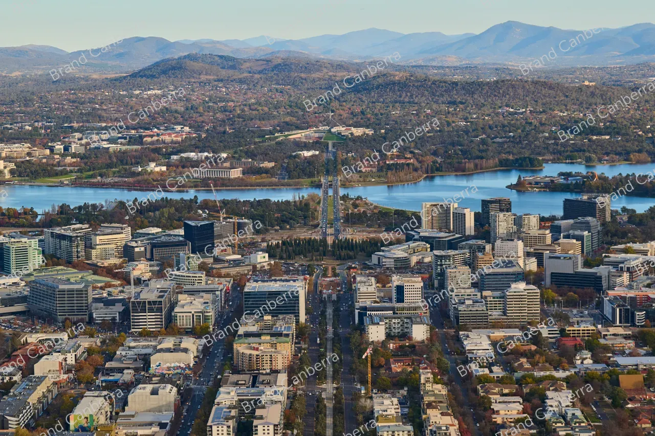 An aerial view over Canberra's Northbourne Avenue with Australia's Parliament House in view