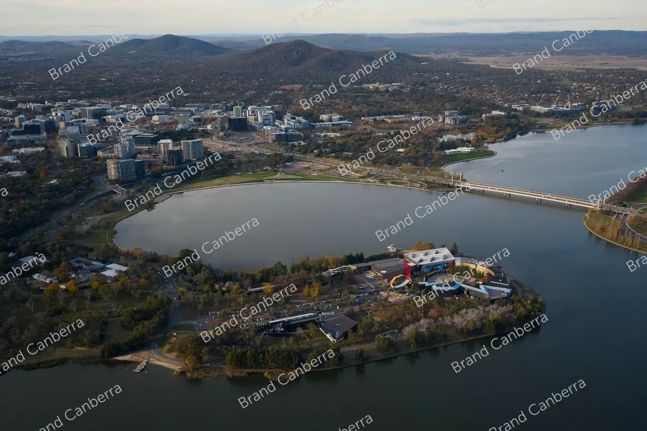 An aerial view over Canberra facing east with the National Museum of Australia in view and Canberra CBD in the distance (1)