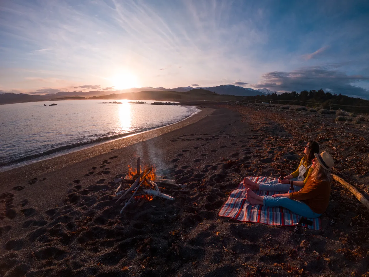 Scenic Sunset Beach with Mountains