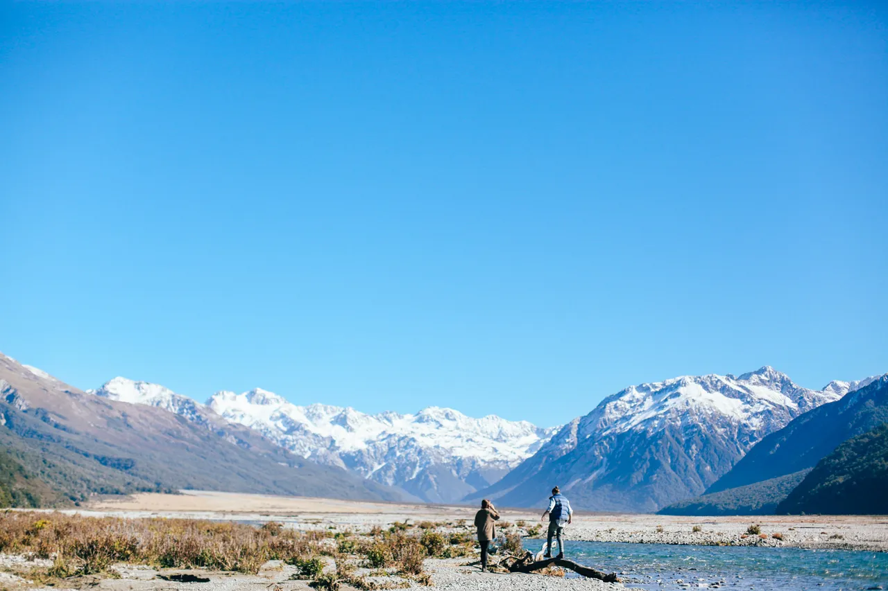Couple walking at the Waimakariri River