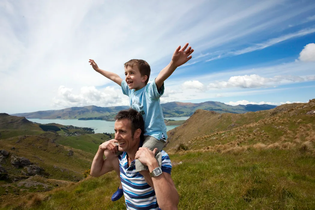 Father and son walking on Port Hills
