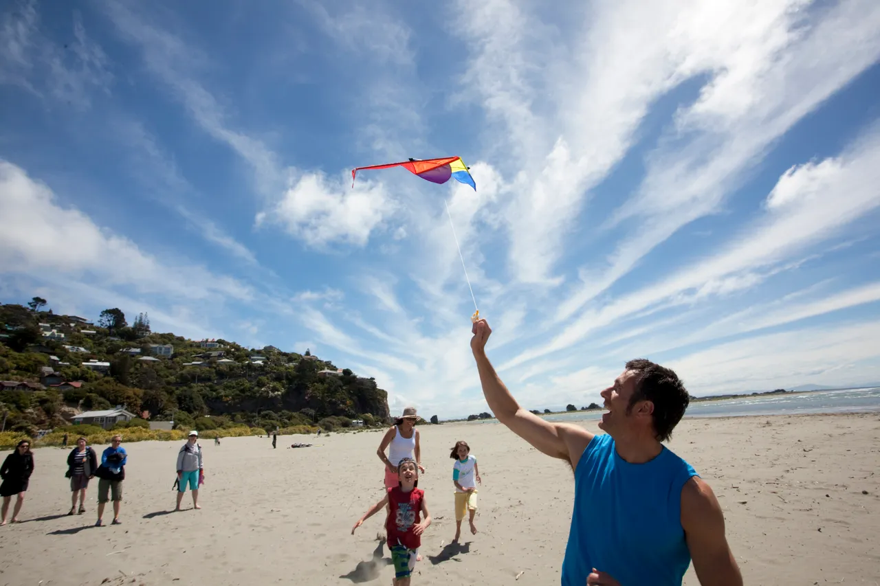 Family with kite on Sumner Beach